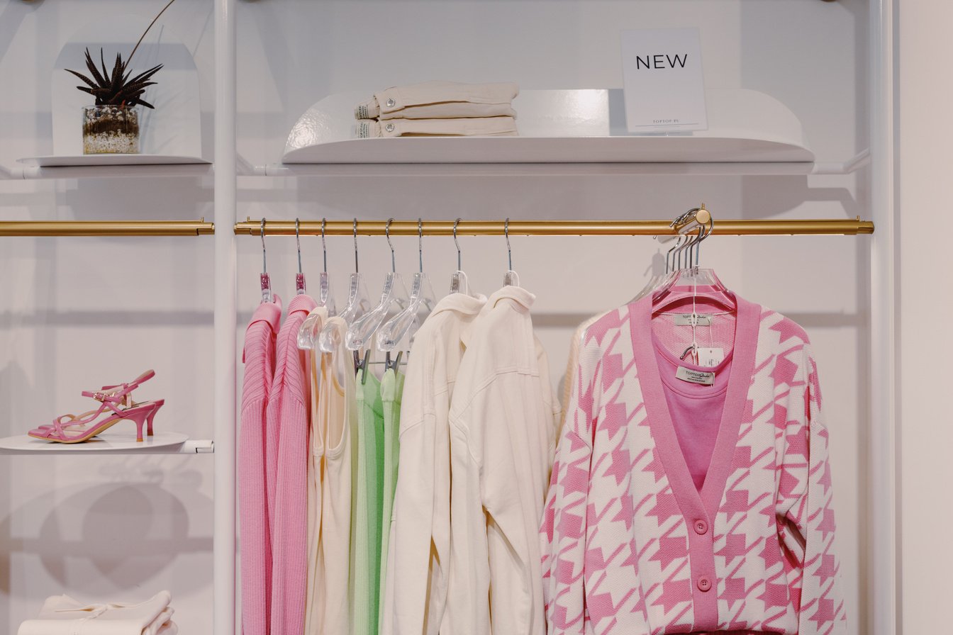 A Set of Clothes Hanging on a Clothing Rack 