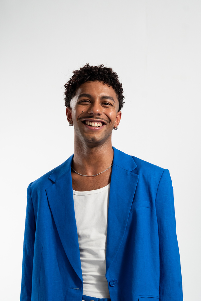 Portrait of a Smiling Man in Blue Coat