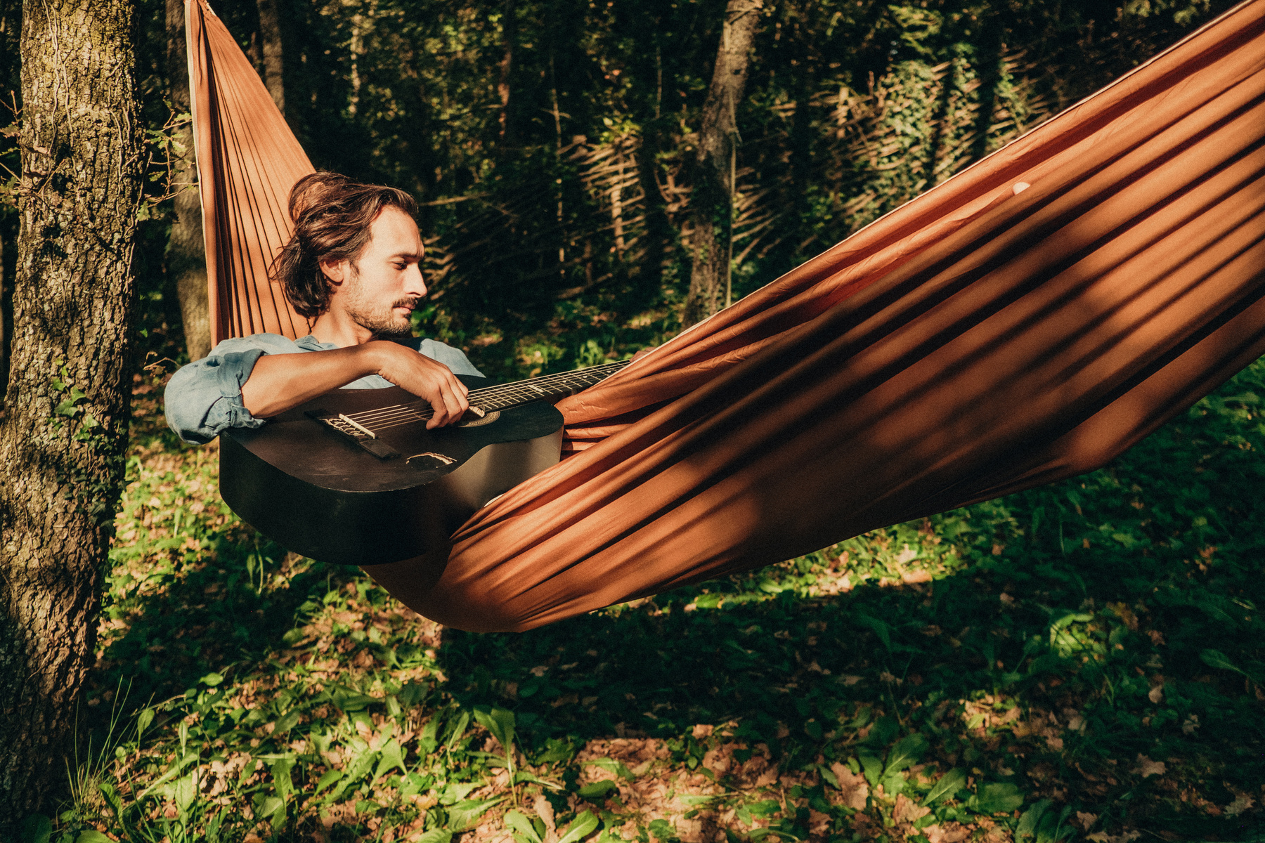 Man Relaxing in Hammock